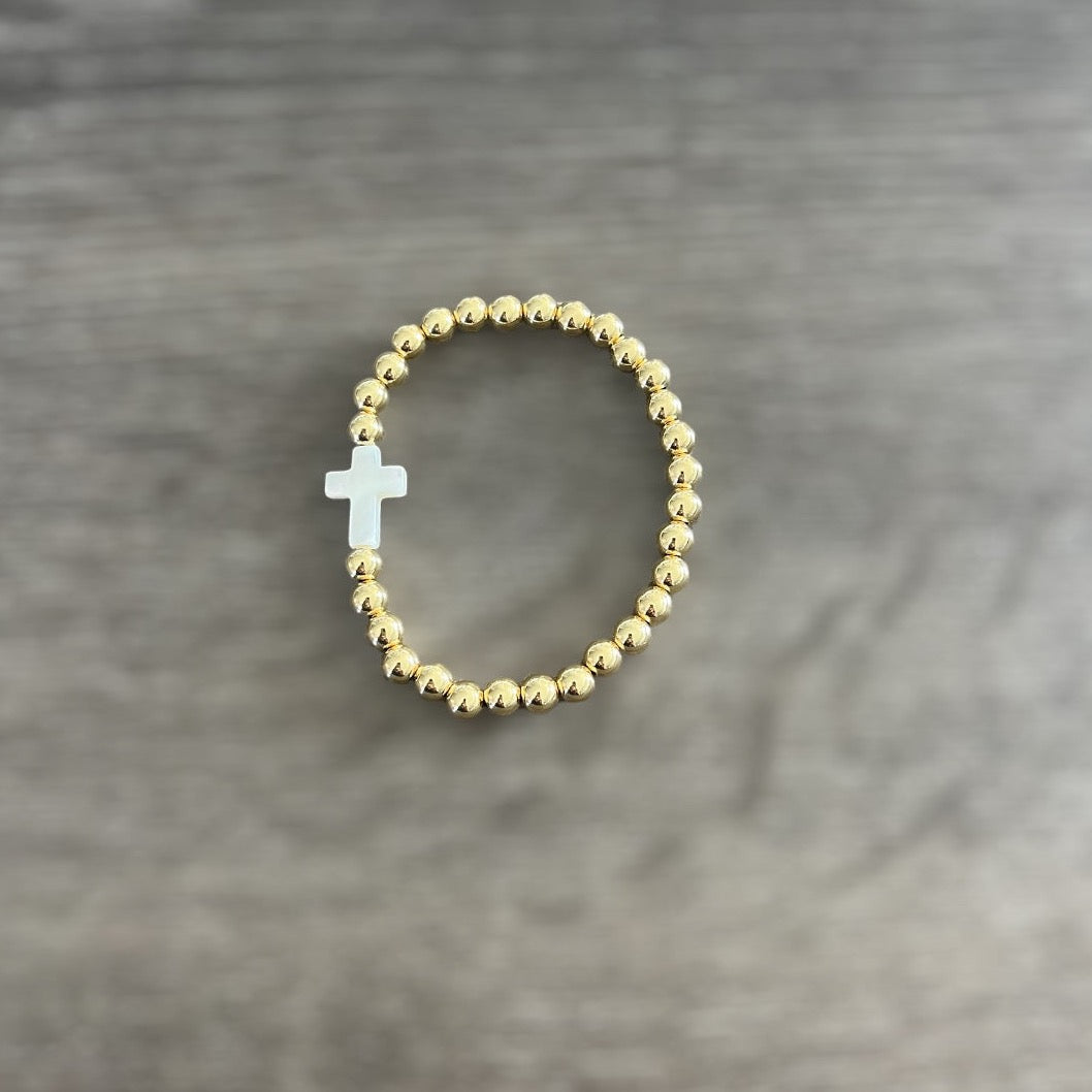 Gold Bracelet With White Shell Cross Bead.