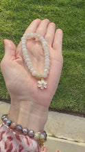 Load and play video in Gallery viewer, Moonstone Bracelet with Flower Charm
